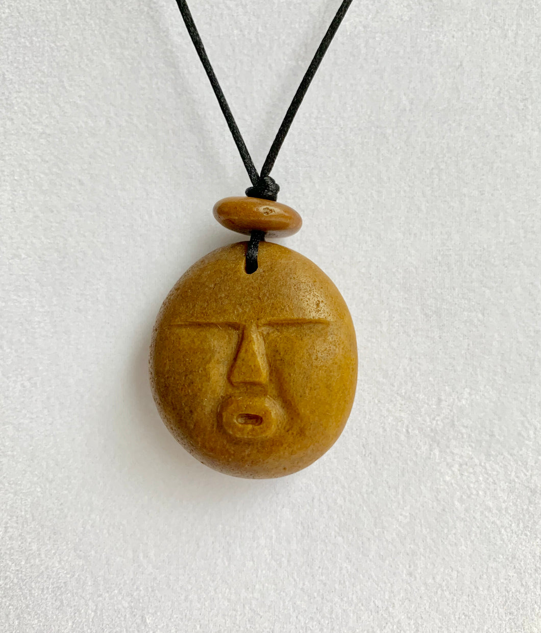 Beach Rock Carved Face necklace